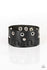 Mainstreet Motocross-Black Bracelet-Jazzi Jewelz Boutique by Raven   Infused with silver rings and silver studs, a band of leather cording is threaded down the side of a black leather band for a rugged look. Features an adjustable snap closure.  Sold as one individual bracelet.