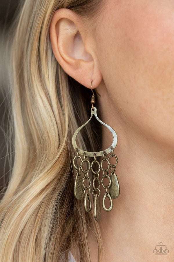 ﻿Lure Away-Brass Paparazzi Earrings-Jazzi Jewelz Boutique by Raven   Solid and airy brass teardrop frames dangle from textured brass links that cascade from the bottom of an antiqued teardrop frame, creating a gritty lure. Earring attaches to a standard fishhook fitting.  Sold as one pair of earrings.  All Paparazzi Accessories are lead free and nickel free.
