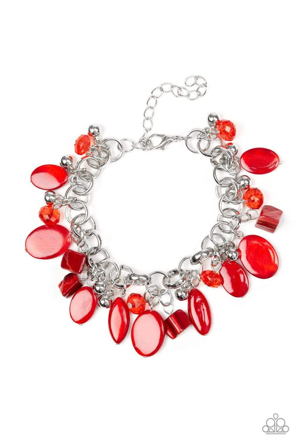 Shop Our Seashore Sailing Red Bracelet  A red bracelet with a collection of red shell-like beads, red crystal-like beads, and shiny silver beads swing from a silver chain