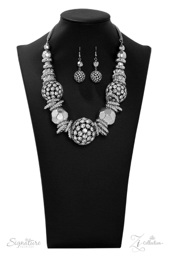 The Barbara 2019 Zi Collection-Silver Necklace-Jazzi Jewelz Boutique by Raven The Barbara.Statement necklace with oversized beads encrusted in rhinestones collide with textured silver hoops and large faceted silver beads in this jaw-dropping piece. The metallic accents and shimmering spheres increase in size as they inch towards the center, resulting in a statement piece that demands a doubletake. Features an adjustable clasp.