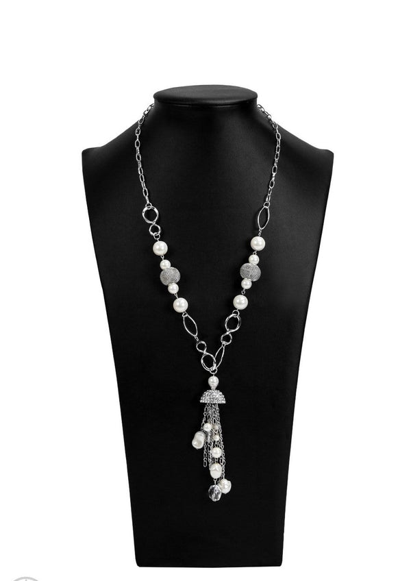 ﻿Designated Diva-White Rhinestone Paparazzi Necklace-Jazzi Jewelz Boutique by Raven  A half-shell studded in rhinestones overhangs a cluster of ivory pearls, tassels of silver chain, and small crystals. Two large wire mesh spheres and larger ivory pearls decorate the neckline.  Sold as one individual necklace. Includes one pair of matching earrings.  All Paparazzi Accessories are 100% lead free and nickel free.