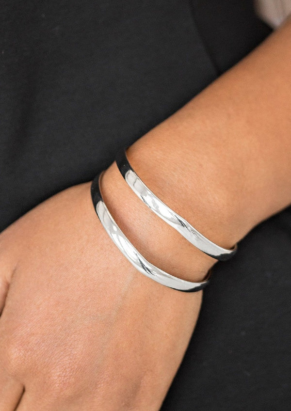 Palm Trees & Pyramids-Silver Paparazzi Bracelet-Jazzi Jewelz Boutique by Raven  Glistening silver bars race across the wrist, coalescing into an airy cuff. The shimmery bars slightly flare at the center, for a subtle geometric finish.  Sold as one individual bracelet.
