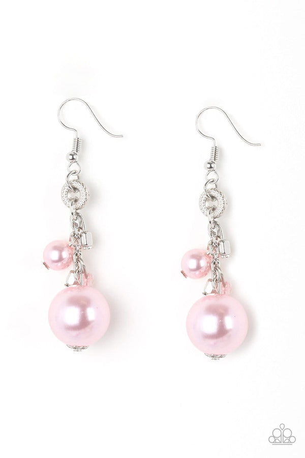 Timelessly Traditional-Pink Paparazzi Earrings-Jazzi Jewelz Boutique by Raven   A bubbly pink pearl, glassy crystal-like beads, and shimmery silver cube beads trickle along a glistening silver chain. An oversized pink pearl swings from the bottom of the chain, creating a dramatic lure. Earring attaches to a standard fishhook fitting.  Sold as one pair of earrings.  Paparazzi Accessories are 100% lead free and nickel free. 