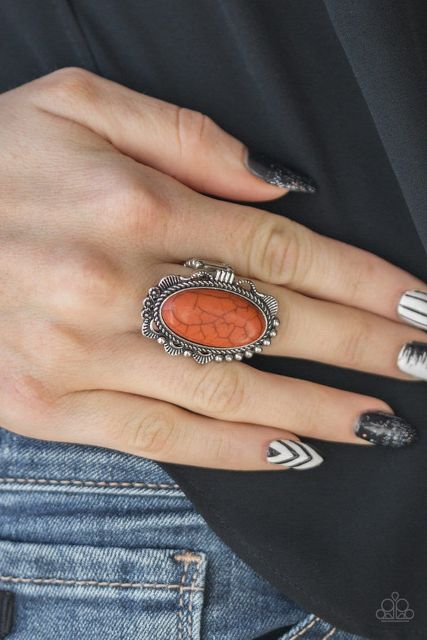 Open Range-Orange Paparazzi Ring-Jazzi Jewelz Boutique by Raven   A refreshing orange stone is pressed into an ornate silver frame rippling with studded and serrated textures for a seasonal flair. Features a stretchy band for a flexible fit.  Sold as one individual ring.