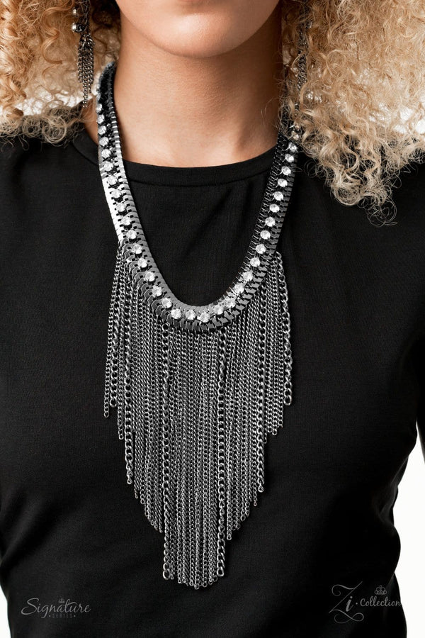 The Alex 2020 Zi Collection-Gunmetal Necklace-Jazzi Jewelz Boutique by Raven   A sassy curtain of mismatched gunmetal chains tapers from the bottom of a dramatic row of glassy white rhinestones that have been delicately fastened to an edgy row of flattened gunmetal chain. The exaggerated fringe cascades down the chest, resulting in a dauntless attitude that demands attention with every swish of the fearless fringe. Features an adjustable clasp closure.