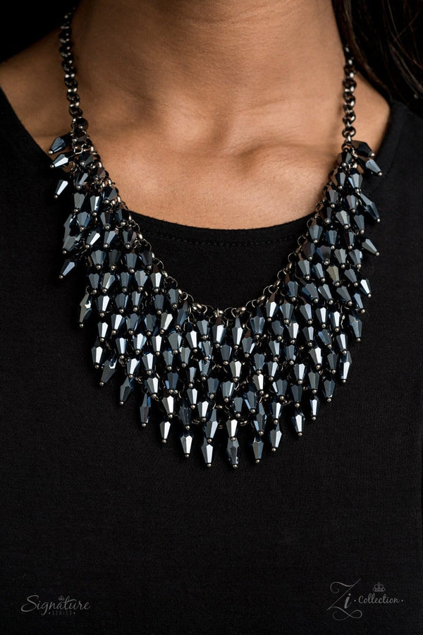 The Heather 2020 Zi Collection-Gunmetal Necklace-Jazzi Jewelz Boutique by Raven   Row after row of metallic blue beads swing from an edgy net of glistening gunmetal links, layering into an edgy fringe below the collar. Featuring flashy faceted edges, the mesmerizing beads spark and sizzle into a conflagration of sparkle below the collar. Features an adjustable clasp closure.  