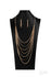 Commanding-2020 Zi Collection-Gold Necklace-Jazzi Jewelz Boutique by Raven  Dramatically capped in bold fittings, lengthened rows of gold herringbone chains layer flawlessly together across the chest. The sleek display attaches to strands of oversized gold links, adding a gritty industrial edge to this majestic masterpiece. Features an adjustable clasp closure.  Sold as one individual necklace. Includes one pair of matching earrings.