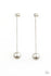 ﻿Extended Elegance-Pearl Paparazzi Earrings-Jazzi Jewelz Boutique by Raven  Attached to a sleek silver chain, an oversized white pearl delicately swings from the bottom of a classic white pearl, adding a timeless twist to the elegant display. Earring attaches to a standard post fitting.  Sold as one pair of post earrings.  All Paparazzi Accessories are lead free and nickel free.