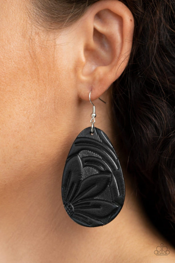 ﻿Garden Therapy-Black Earrings-Jazzi Jewelz Boutique by Raven  Stamped and embossed in floral detail, a black leather teardrop frame swings from the ear for a whimsically seasonal look. Earring attaches to a standard fishhook fitting.  Sold as one pair of earrings.  Paparazzi Accessories are lead free and nickel free. 