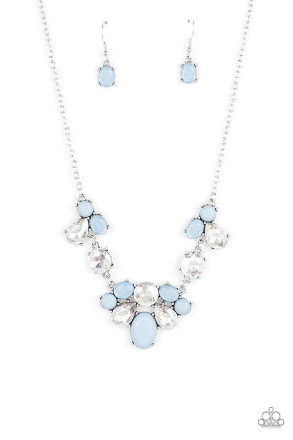 Ethereal Romance-Blue Paparazzi Necklace-Jazzi Jewelz Boutique by Raven  Varying in opacity and shape, mismatched Cerulean beads attach to oversized white rhinestones, creating bubbly frames that delicately link into an ethereal display below the collar. Features an adjustable clasp closure.  Sold as one individual necklace. Includes one pair of matching earrings.  All Paparazzi Accessories are 100% lead free and nickel free.
