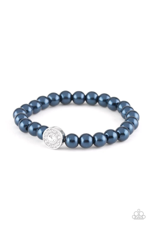 ﻿Follow My Lead-Blue Paparazzi Bracelet- Blue pearls and a white rhinestone encrusted silver charm are threaded along with a stretchy band, creating a glamorous centerpiece atop the wrist. Sold as one individual bracelet.