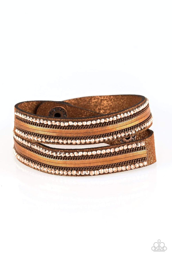 Rocker Rivalry-Copper Paparazzi Bracelet-Jazzi Jewelz Boutique by Raven  Rows of classic copper chain, flat copper chain, and dainty metallic rhinestones are encrusted along a brown suede band dusted in golden sparkles for a sassy look. The elongated band allows for a trendy double wrap design. Features an adjustable snap closure. Sold as one individual bracelet.  All Paparazzi Jewelry is 100% lead free and nickel free.