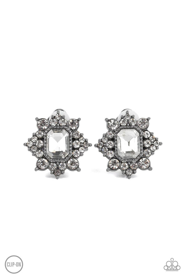 ﻿Interstellar Sparkle-Gunmetal Paparazzi Clip-On Earrings-Jazzi Jewelz Boutique by Raven  Featuring sleek gunmetal fittings, dainty white rhinestones coalesce around a glittery white emerald style rhinestone center for a stellar look. Earring attaches to a standard clip-on fitting. Sold as one pair of clip-on earrings.  Paparazzi Jewelry is lead free and nickel free. 