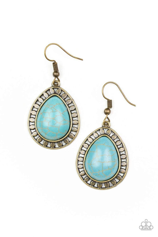 Sahara Serenity-Brass Paparazzi Earrings-Jazzi Jewelz Boutique by Raven  Chiseled into a tranquil teardrop, a refreshing turquoise stone is pressed into a shimmery brass frame radiating with tribal inspired textures for a seasonal look. Earring attaches to a standard fishhook fitting.  Sold as one pair of earrings.  Paparazzi Jewelry is always lead free and nickel free. 