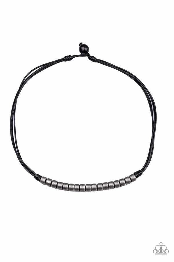 On The TREASURE Hunt-Black Men's Necklace-Jazzi Jewelz Boutique by Raven
 A row of antiqued metal beads is knotted in place along strands of black cording below the collar for a seasonal look. Features a button loop closure.
Sold as one individual necklace.
