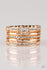 The Dealmaker-Rose Gold Paparazzi Ring-Jazzi Jewelz Boutique by Raven  Encrusted in glassy white rhinestones, glittery bands alternate with shiny rose gold bands across the finger. A slightly larger rhinestone adorns the uppermost band for a refined finish. Features a stretchy band for a flexible fit. Sold as one individual ring.