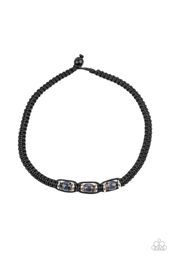 Surfers Paradise-Black Urban Paparazzi Necklace-Jazzi Jewelz Boutique by Raven  Infused with dainty silver discs and colorfully glassy beads, black cording braids around the neck for an island-inspired display. Features a button-loop closure.  Sold as one individual necklace.  All Paparazzi Accessories are lead free and nickel free. 