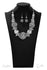 The Barbara 2019 Zi Collection-Silver Necklace-Jazzi Jewelz Boutique by Raven The Barbara.Statement necklace with oversized beads encrusted in rhinestones collide with textured silver hoops and large faceted silver beads in this jaw-dropping piece. The metallic accents and shimmering spheres increase in size as they inch towards the center, resulting in a statement piece that demands a doubletake. Features an adjustable clasp.