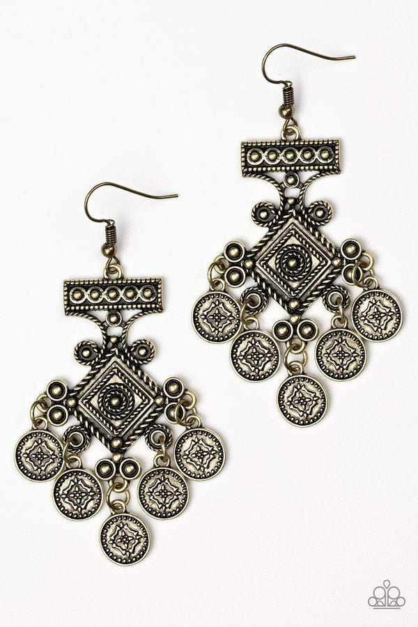 ﻿Unexplored Lands-Brass Paparazzi Earrings-Jazzi Jewelz Boutique by Raven  Radiating with tribal inspired details, brass coin-like discs swing from the bottom of an ornate brass frame, creating a whimsical fringe. Earring attaches to a standard fishhook fitting.  Sold as one pair of earrings.